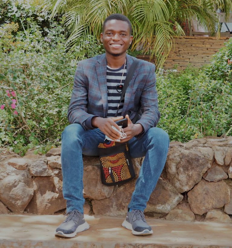 Maso, owner of Cocohut, sitting in the garden