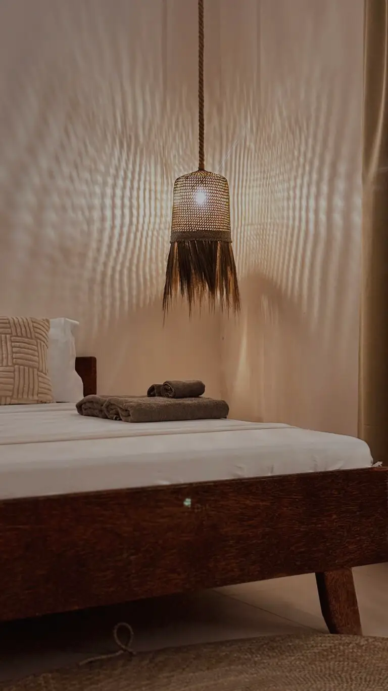 Made bed with folded towels