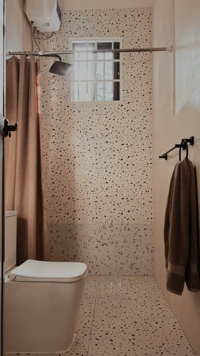 Walk-in rain shower with terrazzo walls