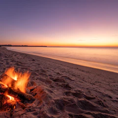 Fire on the beach at dusk